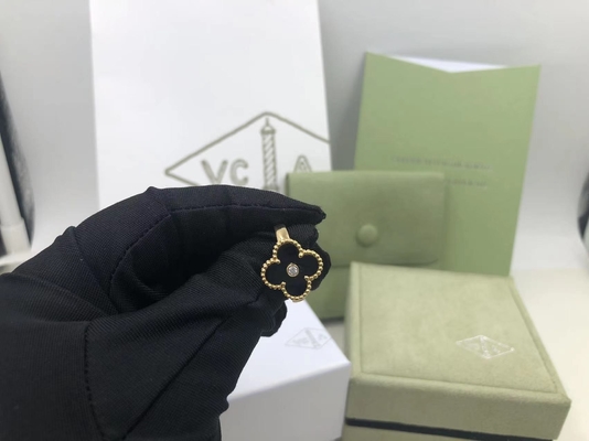 Van Cleef и диамант круга оникса желтого золота кольца Альгамбра года сбора винограда Arpels