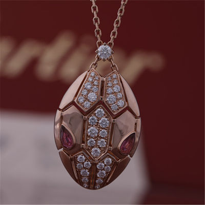 Качество Римское ожерелье Serpenti в 18 kt подняло золото установило с глазами rubellite и с диамантами pavé на голове фабрика