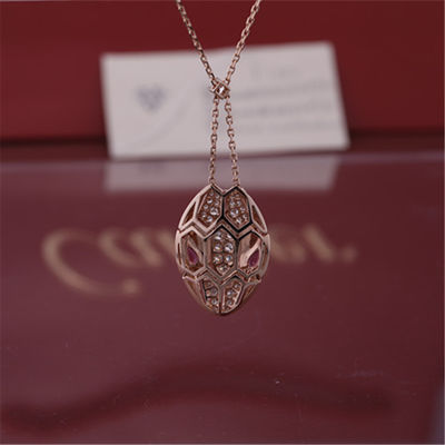 Качество Римское ожерелье Serpenti в 18 kt подняло золото установило с глазами rubellite и с диамантами pavé на голове фабрика
