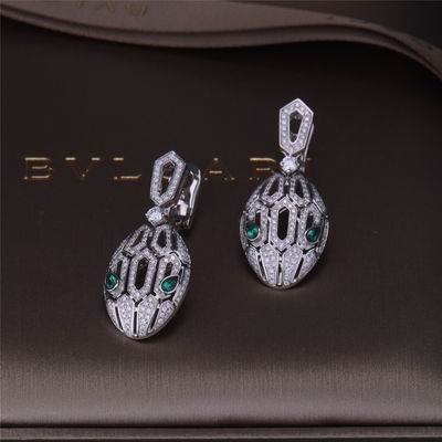 Качество Роскошные серьги Serpenti бренда золота в наборе белого золота 18K с изумрудными глазами и с головой змейки диамантов pavé фабрика